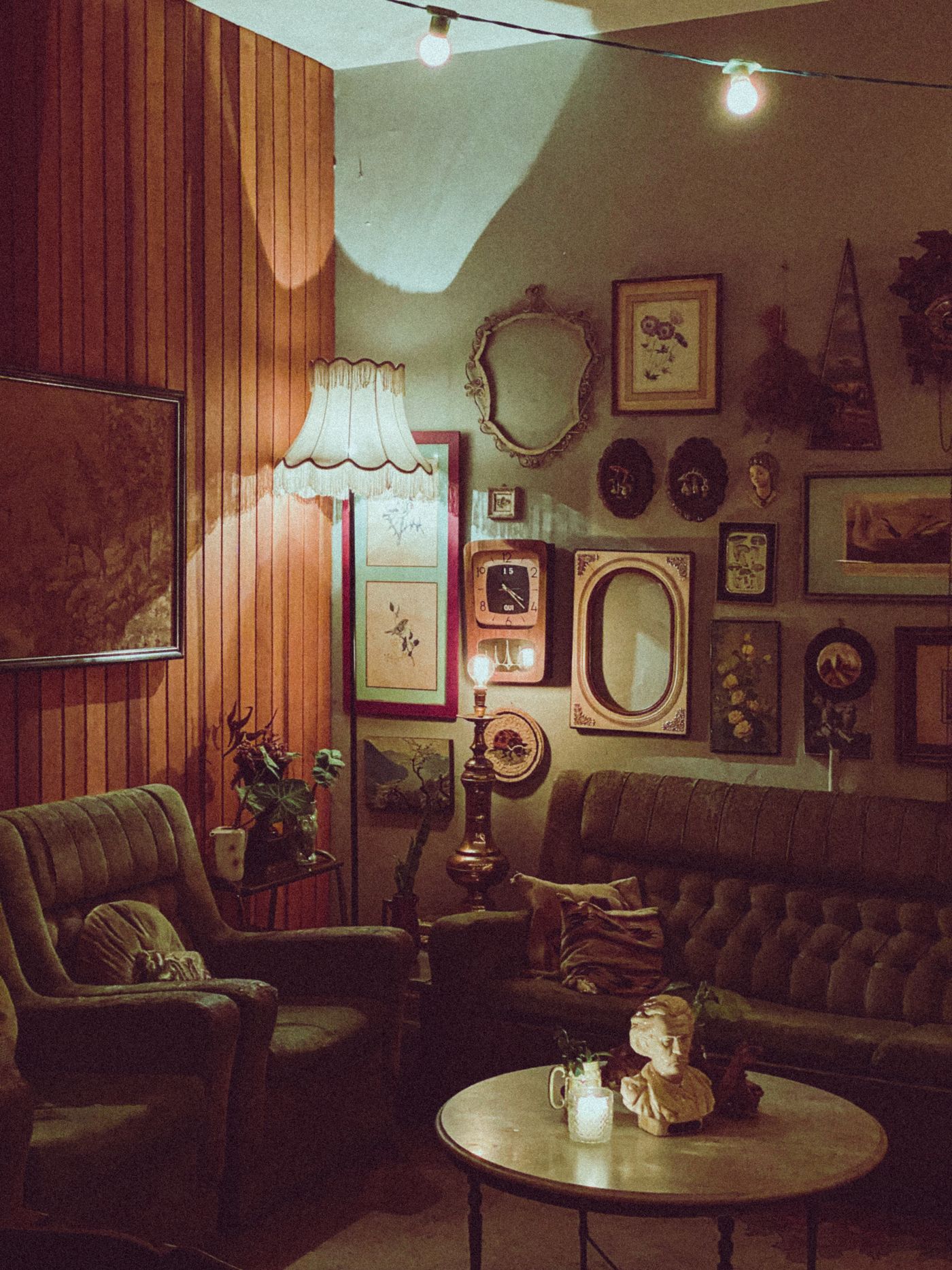 A warm vintage living room filled with collectible furnishings